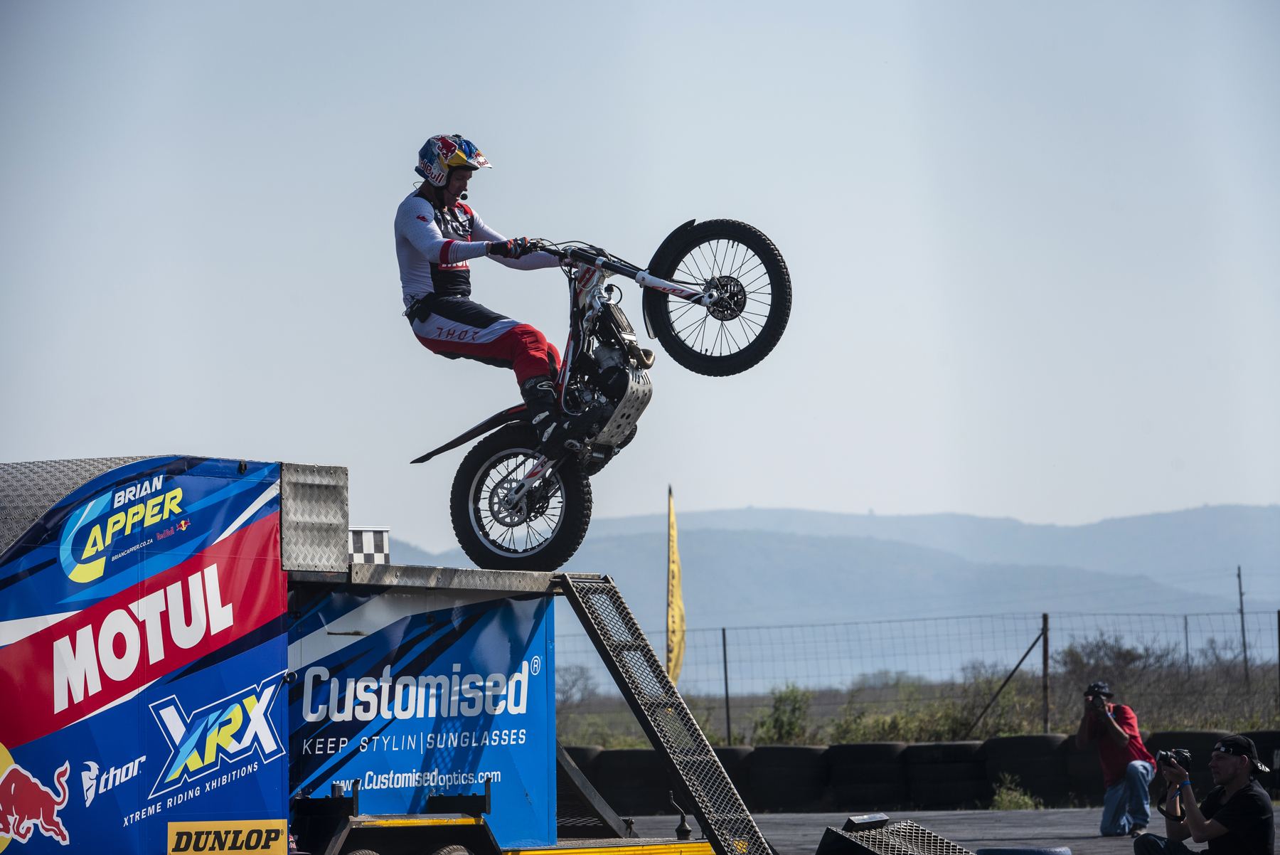 Trials motorbike jumping a ramp