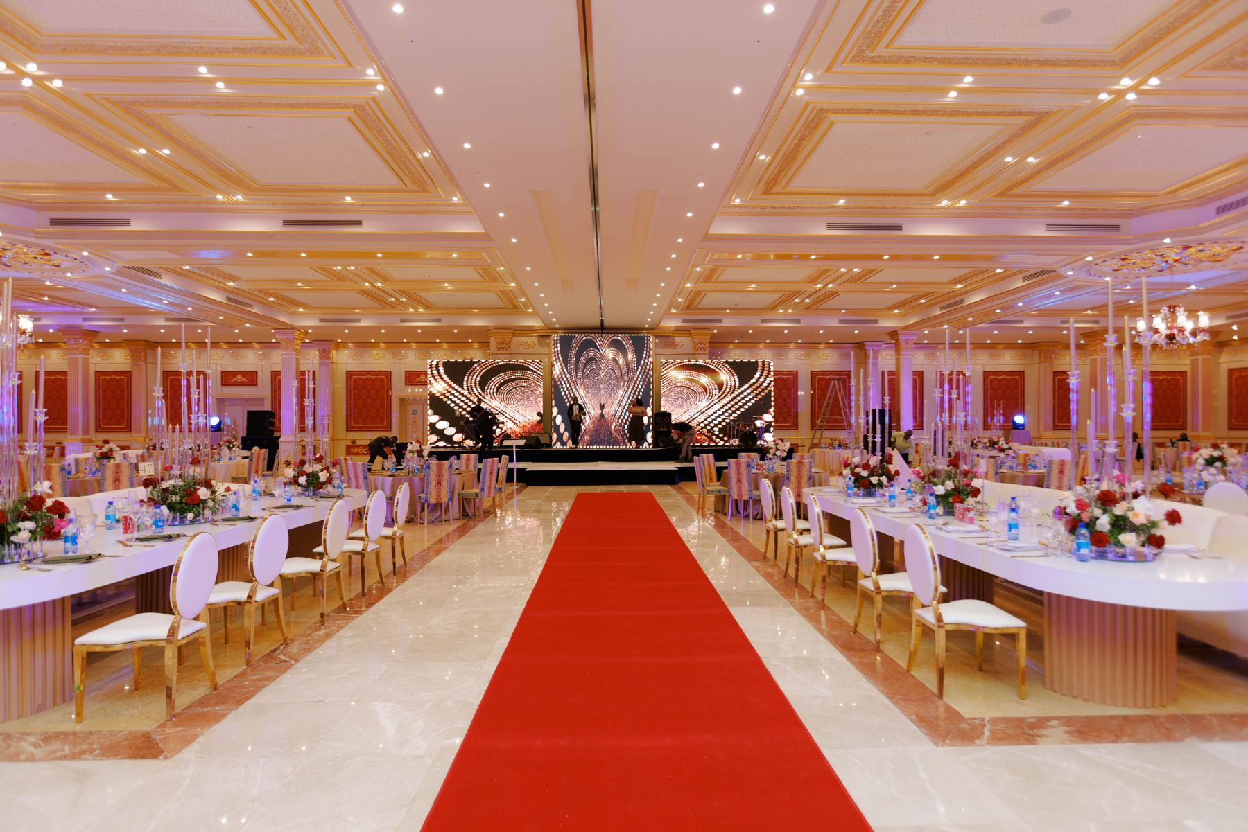 Ballroom with long tables and red carpet